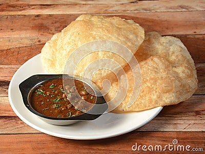 Peshwari Chole Bhature, spicy Chick Peas curry also known as Chole or Channa Masala usually served with fried puri or Bhature, Stock Photo