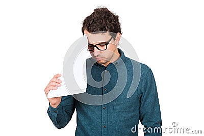 Pessimistic businessman looking down upset, as holds different paper documents on white background. Confused business Stock Photo