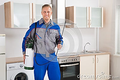 Pest Control Worker With Insecticide Sprayer Stock Photo