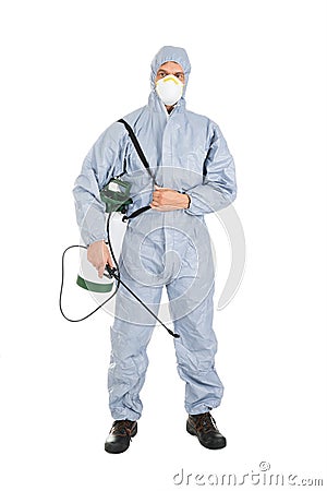 Pest control worker with pesticides sprayer Stock Photo