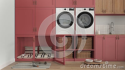 Pet friendly mudroom in red tones, laundry room with appliances, dryer and washing machine, Dog bed with pillows and gate inside Stock Photo