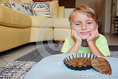 Pet perspective: join a smiling thoughtful kid with a food bowl Stock Photo