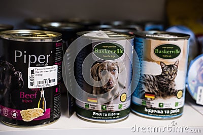 Pet shop. Dog and cat Flavor Canned Food Products On Animals Supermarket Shelf. Kropivnitskiy, Ukraine, July 28, 2020 Editorial Stock Photo