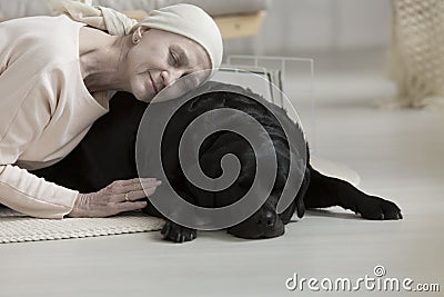 Pet therapy helping woman Stock Photo