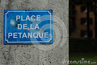 Petanque boule sign in washed out blue Stock Photo