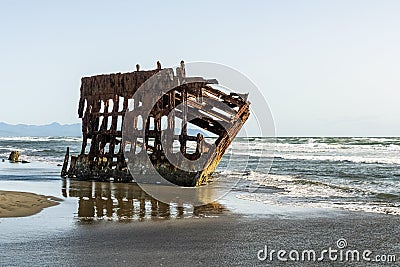 Peter Iredale Shipwreck on late afternoon, Fort Stevens State Park, Pacific Coast, Astoria, Oregon, USA Stock Photo