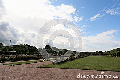 Petergof, Russia, July 2019. Blue sky with thunderclouds above the lawns of the park. Editorial Stock Photo