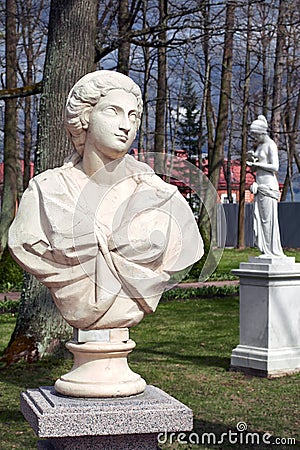 Peterhof, Russia, May 4-Antique statue in the summer garden in the sunlight Editorial Stock Photo