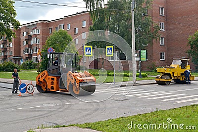 PETERHOF, RUSSIA.Road skating rinks work at asphalt laying Editorial Stock Photo