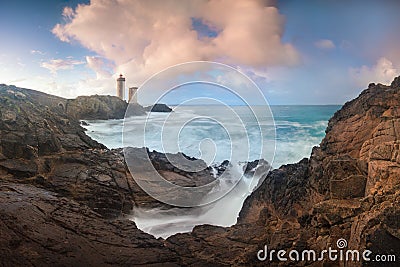 Petit Minou Lighthouse at sunset with red light , Brest , France View of Lighthouse of Petit Minou in Brittany. Summer season Stock Photo