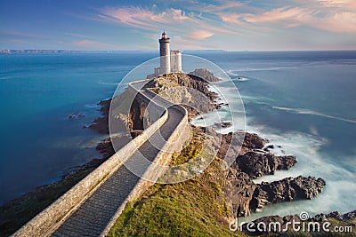 Petit Minou Lighthouse at sunset with red light , Brest , France View of Lighthouse of Petit Minou in Brittany. Stock Photo