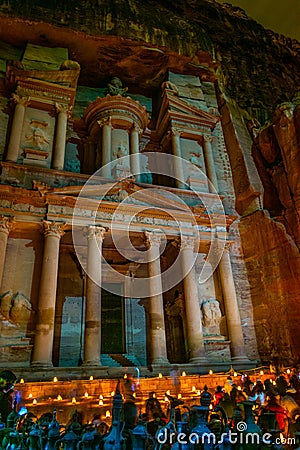 Petra by night tour featuring illuminated Al Khazneh tomb also called Treasury at Petra, Jordan Editorial Stock Photo