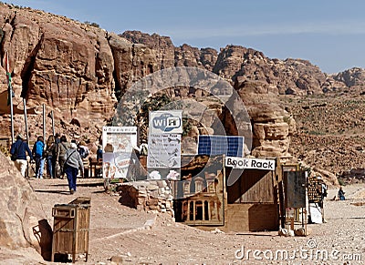 Petra, Wadi Musa, Jordan, March 9, 2018: A stall with many signs of refreshments, books and tourist souvenirs Editorial Stock Photo