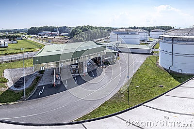 Petrochemical fuel base with loading islands and truck and tanks on the background, Czech Republic Stock Photo