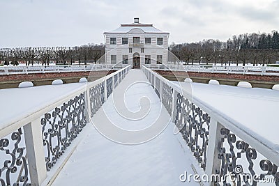 View of the Marly Palace on the Sector Pond on a cloudy February day. Peterhof Editorial Stock Photo