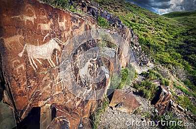 Petroglyph with animals at sunset Editorial Stock Photo