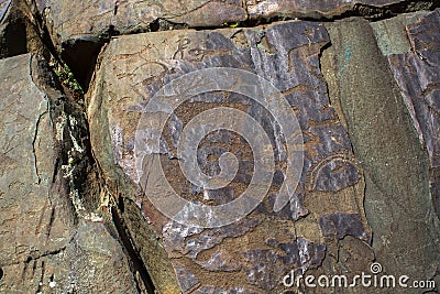 Petroglyphs. Ancient rock paintings in the Altai Mountains Stock Photo