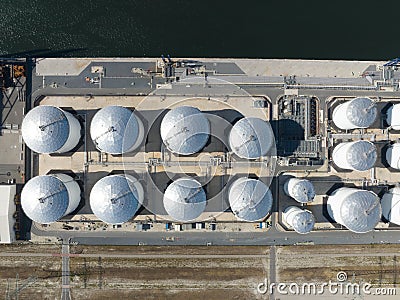 Petroleum oil storage silos. Refinery industrial oil tank container top down aerial drone view. Chemical liquid metal Stock Photo