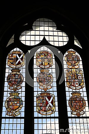 Petworth House - stained glass window of coats of arms Editorial Stock Photo