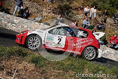 A Peugeot 206 WRC racing car during a timed speed trial in the second edition of the Ronda Di Albenga race that takes place ever Editorial Stock Photo