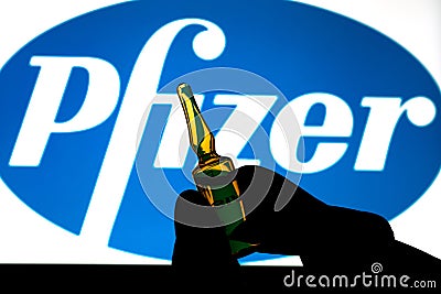 Pfizer coronavirus vaccine pharmaceutical corporation. Logo and hand with vaccine Editorial Stock Photo