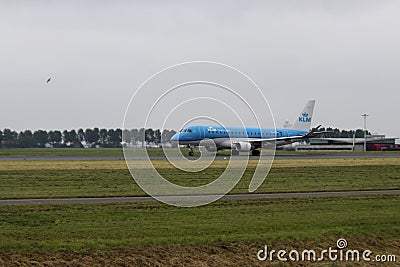 PH-EXI KLM Cityhopper Embraer ERJ Airport is departing from Polderbaan 18R-36L of Schiphol Amsterdam Airport Editorial Stock Photo