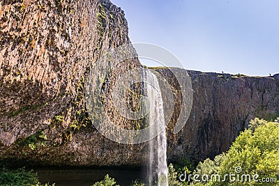 Phantom Waterfall dropping off over vertical basalt walls, North Table Mountain Ecological Reserve, Oroville, California Stock Photo