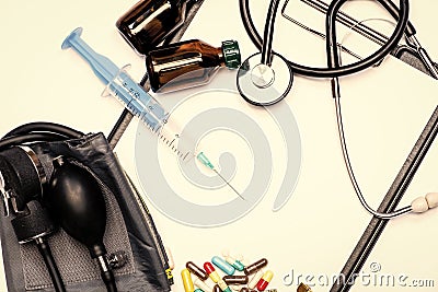 Pharmaceutical drugs syringe vials and tonometer with stethoscope isolated on white, healthcare. Stock Photo