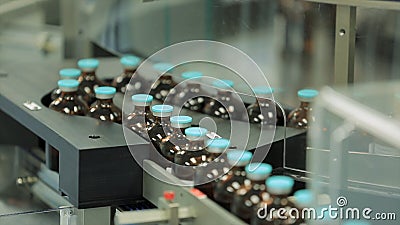 Pharmaceutical industry. Production line machine conveyor at factory with bottles. pharmaceutical production of liquid Stock Photo