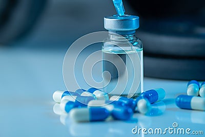 Pharmaceutical syringe with needle and medical pills - illegal doping drugs in sport Stock Photo