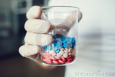 Pharmaceutical worker with pills Stock Photo