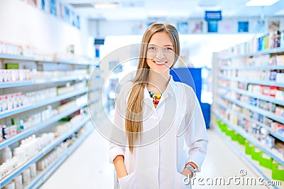 Pharmacist chemist woman standing in pharmacy Stock Photo