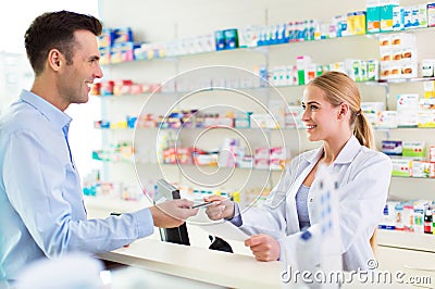 Pharmacist and client at pharmacy Stock Photo