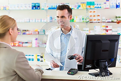 Pharmacist and client at pharmacy Stock Photo