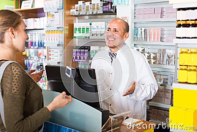 Pharmacist counseling customer Stock Photo