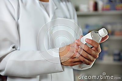 Pharmacist holding a tincture Stock Photo