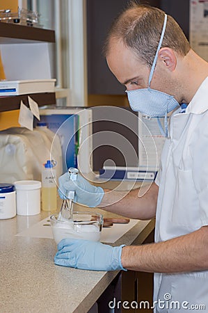 Pharmacist mixing medicine Stock Photo