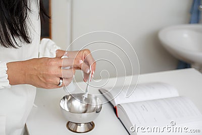 Pharmacist prepare mixture in mortar Stock Photo