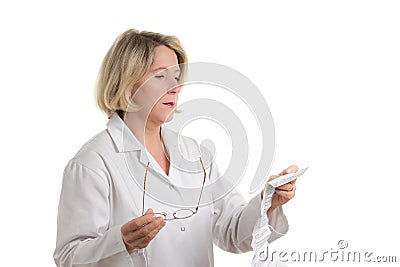 Pharmacist reading patient information sheet Stock Photo