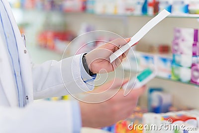 Pharmacist reading prescription Stock Photo