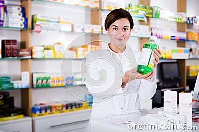 Pharmacist ready to assist in choosing at counter Stock Photo
