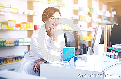 Pharmacist ready to assist in choosing at counter Stock Photo