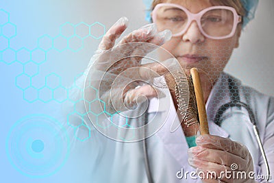 Pharmacist, scientist, doctor holds a comb and removes hair for a test of biological material for DNA, pathology, blue virtual Stock Photo