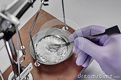 Pharmacist or scientist preparing medicine using precision weighing Stock Photo