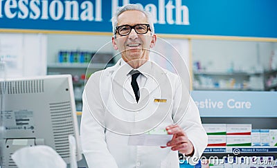 Pharmacists are a force for good in their communities. a male pharmacist working in a chemist. Stock Photo