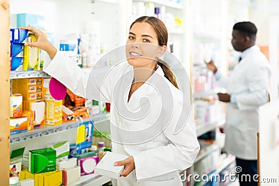 Pharmacists putting drug packages in order Stock Photo