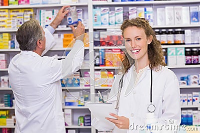 Pharmacists searching medicines with prescription Stock Photo