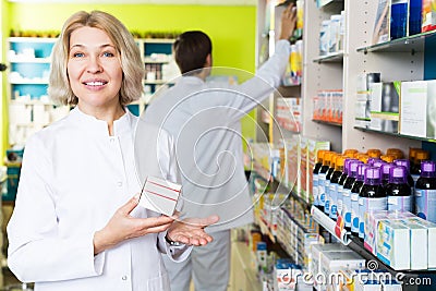 Pharmacists working in modern farmacy Stock Photo