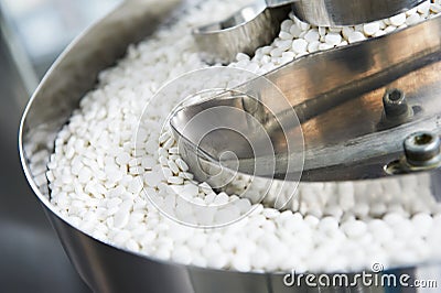 Pharmacy medicine pill production background Stock Photo