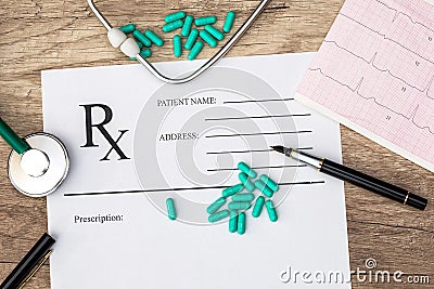 Pharmacy receipt with stethoscope, cardiogram and medication Stock Photo